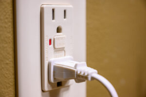GFCI outlet with plug in it