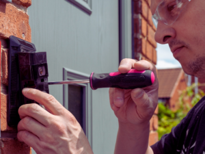 electrician repairing doorball