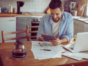 happy homeowner who has saved on energy bill due to smart devices